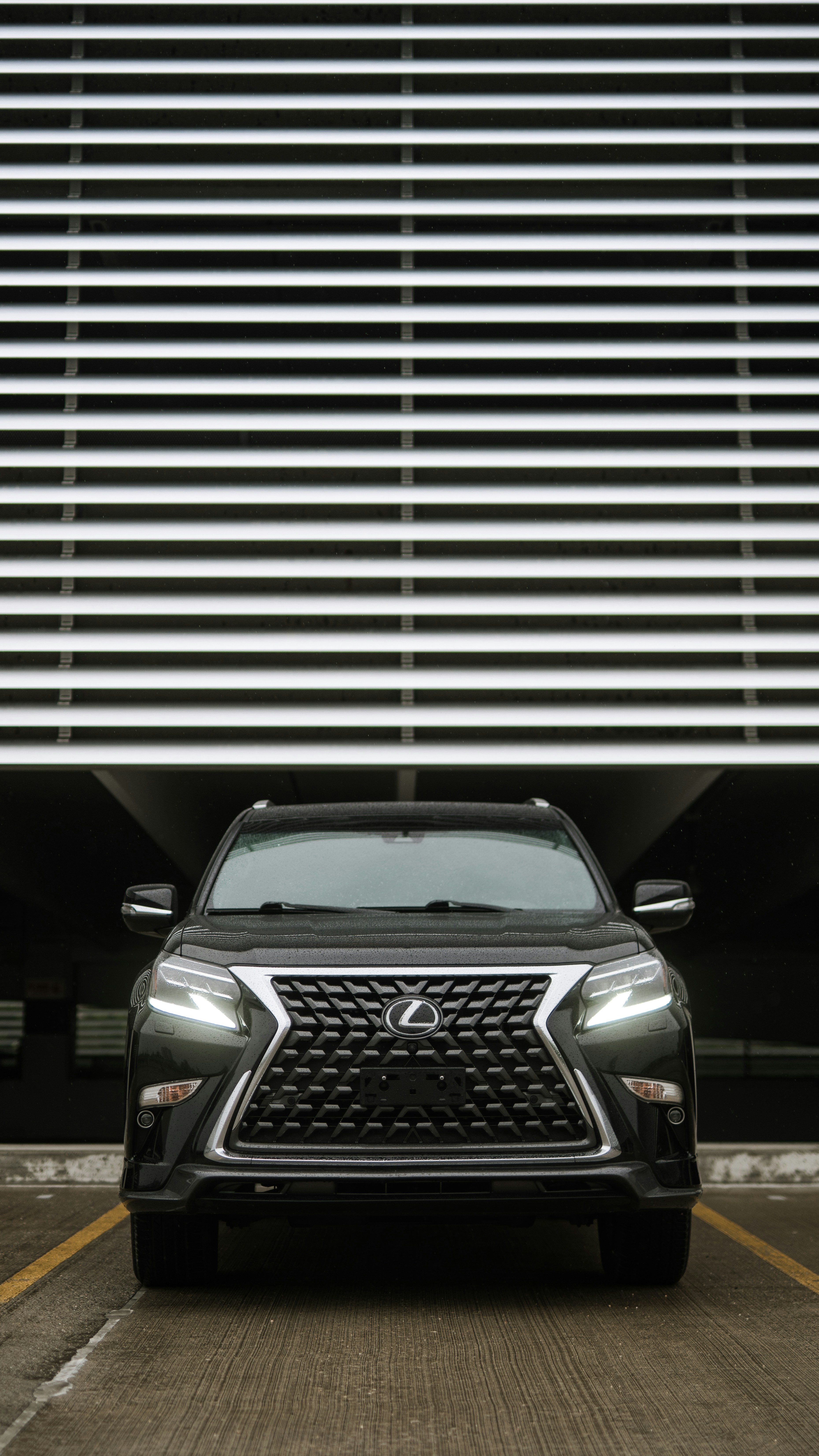 Lexus vehicle leaving a garage
